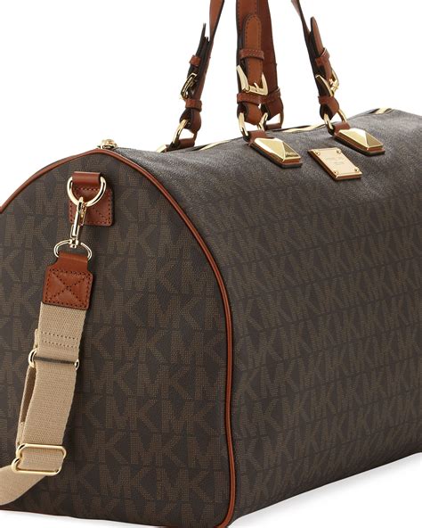 michael kors jet set duffle bag|Michael Kors trolley suitcase.